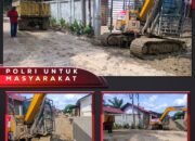 Polres Aceh Tamiang Kerahkan Alat Berat Polri Bersihkan Akses Jalan dan Rumah Warga Pasca Banjir