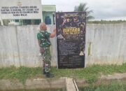 Babinsa Koramil 09/Banda Mulia Pasang Banner Pendaftaran TNI AD, Ajak Generasi Muda Wujudkan Pengabdian kepada Bangsa